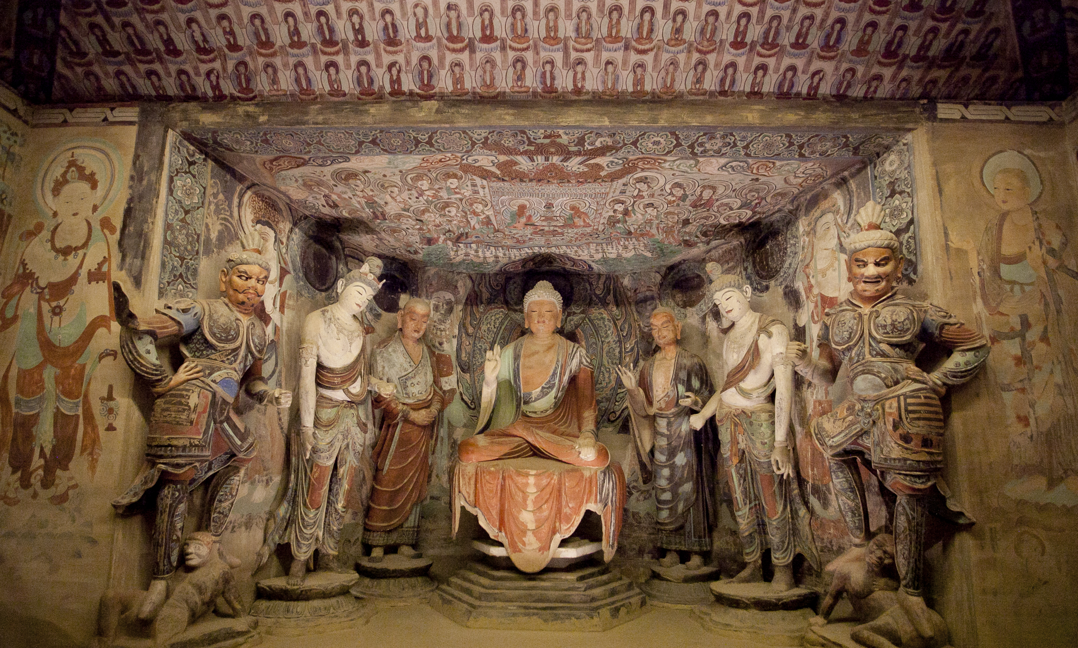 Buddhist septad in the main niche, Mogao Cave 45, High Tang period (705–781), replicated in paint and fiberglass by Zhang Li and Li Lin in 2004. (Samira Bouaou/Epoch Times)